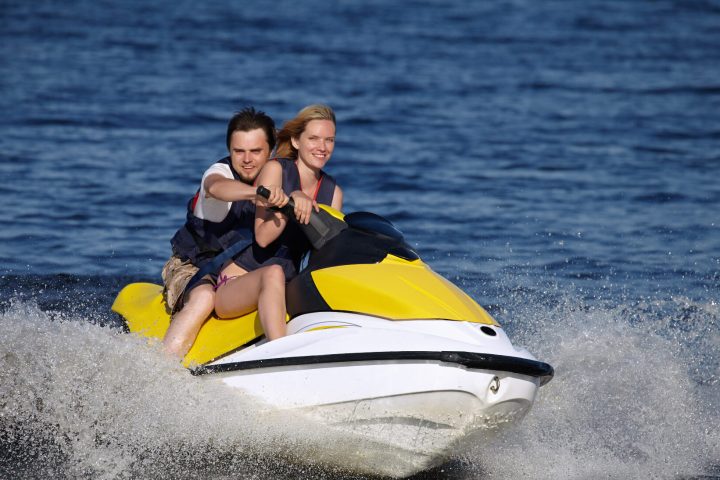 a person riding a surf board on a body of water